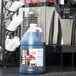 A large jug of Carnival King Root Beer slush syrup on a counter.
