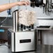 A woman using Bar Maid polishing heads on a glass washer.