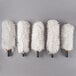A group of six white Bar Maid polishing heads.