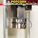 A Carnival King popcorn machine with a large silver kettle.