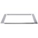 A metal frame with a white rectangular object inside.