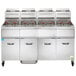 A large commercial fryer with many baskets, the Vulcan 4 Unit Floor Fryer System.