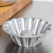 A silver Chicago Metallic cake pan on a counter.