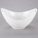 A white bowl with handles.