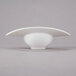A close up of a white bowl with a curved rim.
