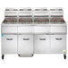 A large commercial Vulcan liquid propane floor fryer system with red handles and many baskets.