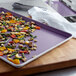 A Chicago Metallic DuraShield non-stick sheet pan with vegetables on it.