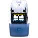 A blue plastic San Jamar roll towel dispenser with a white cover.