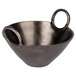 A 10 Strawberry Street Lodo raw black metal bowl with handles.
