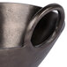 A 10 Strawberry Street Lodo raw black metal bowl with handles.