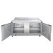 A Beverage-Air stainless steel worktop refrigerator with two doors open.
