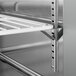 A stainless steel rack inside a Beverage-Air worktop refrigerator.