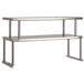 A stainless steel Advance Tabco double overshelf with two shelves on legs.