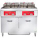 A large commercial Vulcan electric floor fryer system.