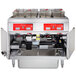 A large Vulcan electric floor fryer system with two units and computer controls.