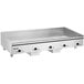 A large stainless steel Vulcan countertop griddle with black knobs.