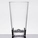 A white background with a stack of clear GET Loft plastic mixing glasses with a small hole in each.