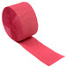 A roll of burgundy streamer paper.