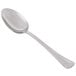 A Libbey stainless steel serving spoon with a silver handle.