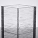 A clear square acrylic riser.