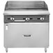 A stainless steel Vulcan gas range with a griddle top and knobs.