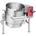 A large stainless steel Vulcan steam kettle with a red lid.