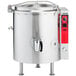 A large stainless steel Vulcan stationary steam kettle with a silver lid.