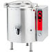 A large stainless steel Vulcan stationary steam jacketed kettle with a red handle.