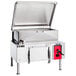 A Vulcan stainless steel 40 gallon tilt skillet with a lid.