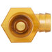 A yellow plastic hexagonal fitting with a hole in a plastic tube.