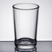 a clear glass with a black rubber band