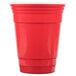 A red 16 oz. reusable plastic tumbler.