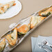 A nickel branch-shaped tray with food and silverware on it.