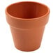 An American Metalcraft terra cotta melamine pot with a lid.