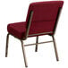 a red chair with gold legs