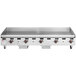 A Wolf stainless steel gas countertop griddle with manual controls.