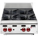 A Wolf stainless steel countertop range with four burners.