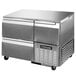 A stainless steel Continental Refrigerator with two drawers and one half door.