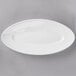 A white oval plate with a rim.