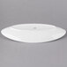 A white oval shaped porcelain plate with a handle on it.