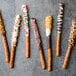 A chocolate covered Snyder's of Hanover pretzel rod with orange and brown sprinkles.