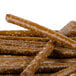 A pile of Snyder's of Hanover pretzel rods with brown sugar on top.