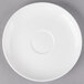 A white 10 Strawberry Street Ricard porcelain saucer with a circle in the center.