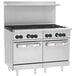 A large stainless steel Wolf commercial gas range with 8 burners and 2 ovens.