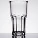 An Arcoroc stackable beverage glass with a rim.