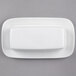 A white rectangular porcelain covered butter dish.