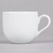 A white porcelain 10 Strawberry Street espresso cup with a handle on a saucer.