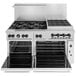 A stainless steel Wolf commercial range with a standard and convection oven and six burners.