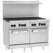 A large stainless steel Wolf commercial range with 8 burners and 2 ovens.