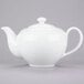 A white 10 Strawberry Street porcelain teapot with a handle.